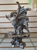 Silver dragon on pedestal