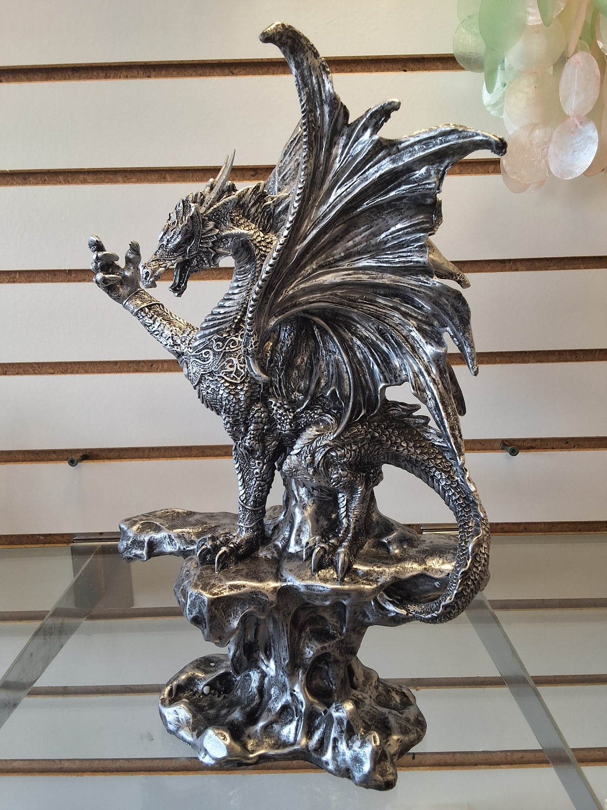 Silver dragon on pedestal