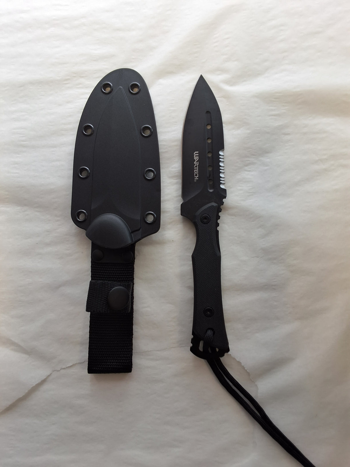 All black knife w/ Serrated edge #3196