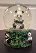 Panda eating bamboo snow globe
