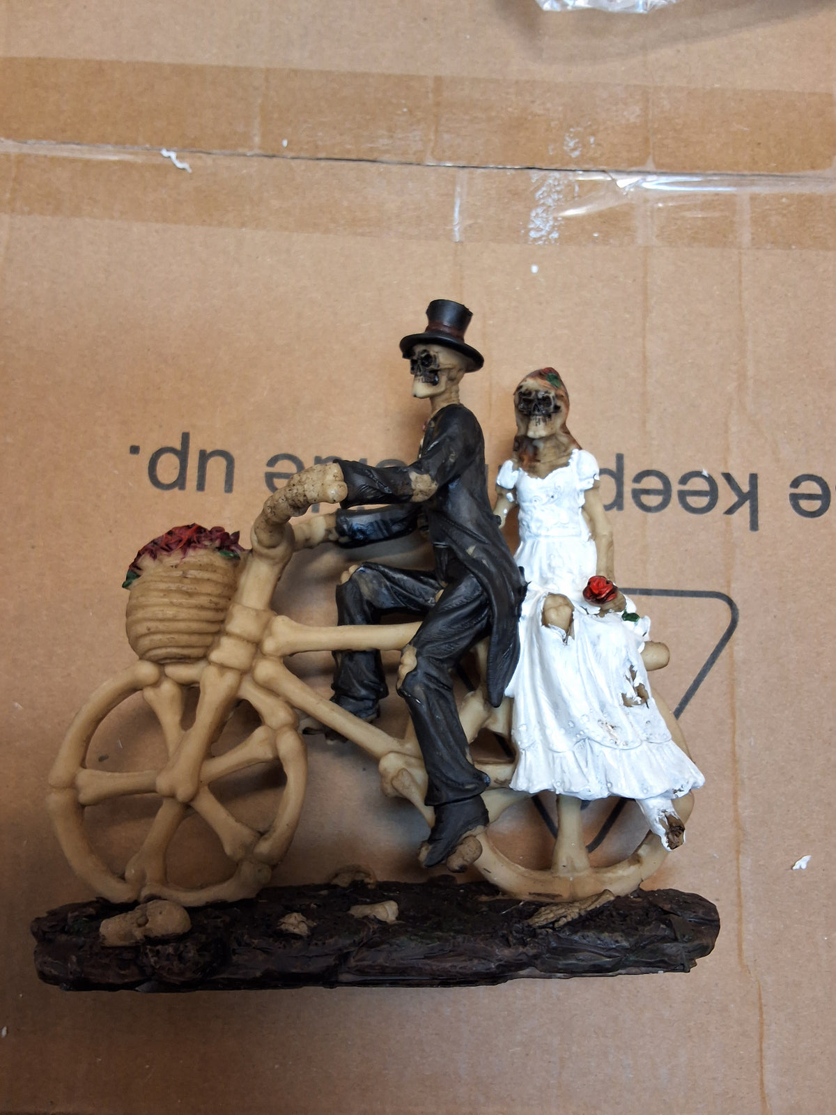 MARRIED SKELETONS ON A BIKE STATUE
