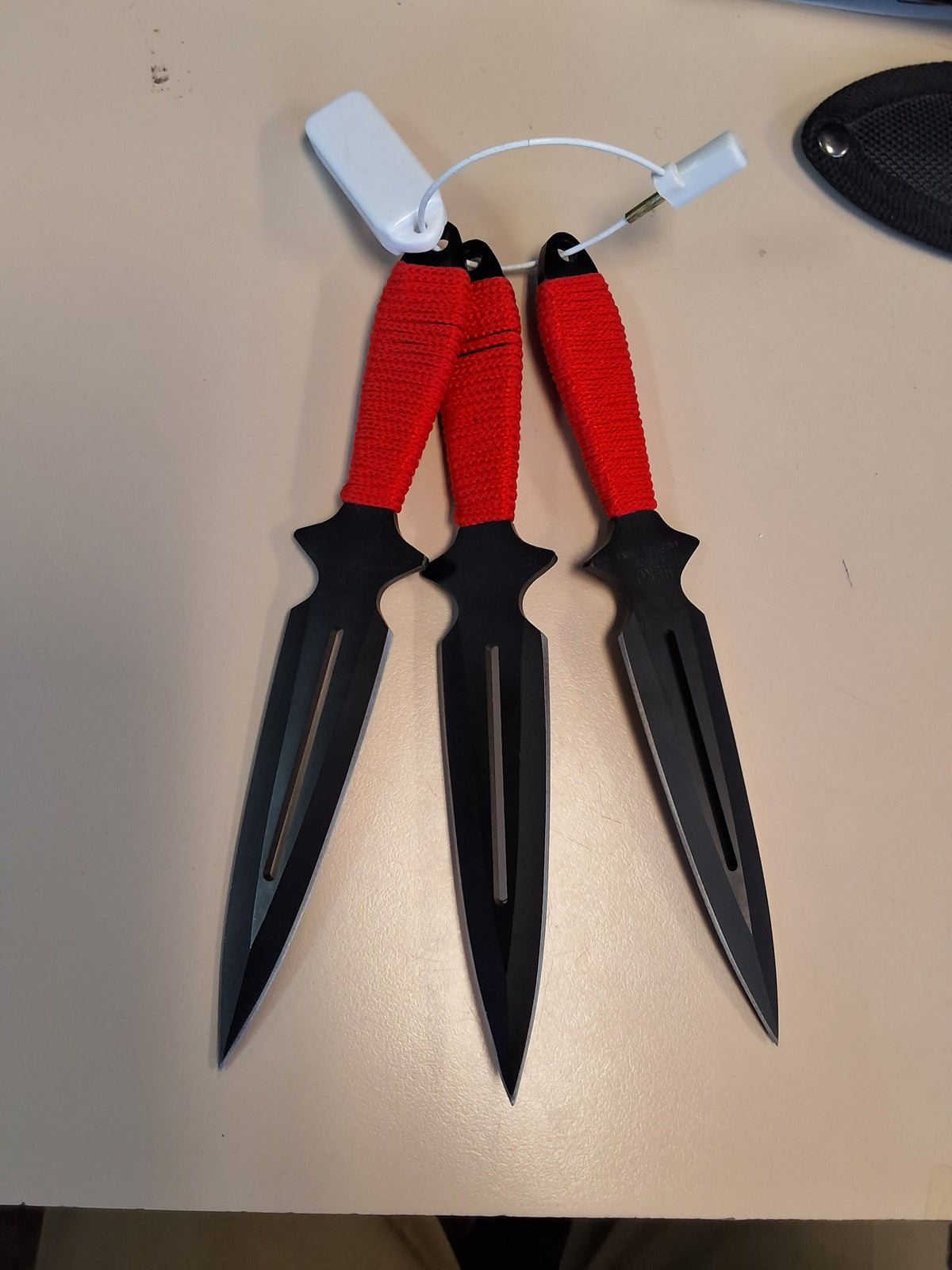 Red and black throwing knives