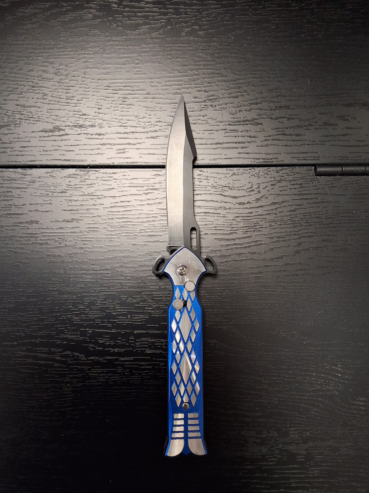 Blue and silver push button knife