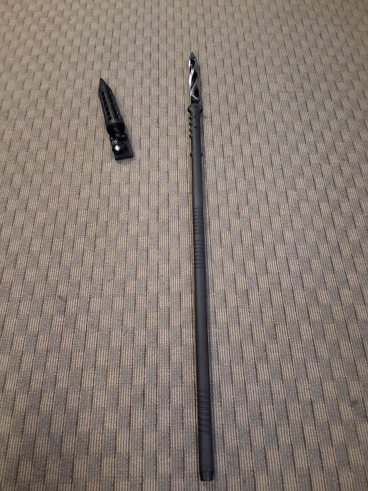 Twisting blade cyclone spear with custom sheathe