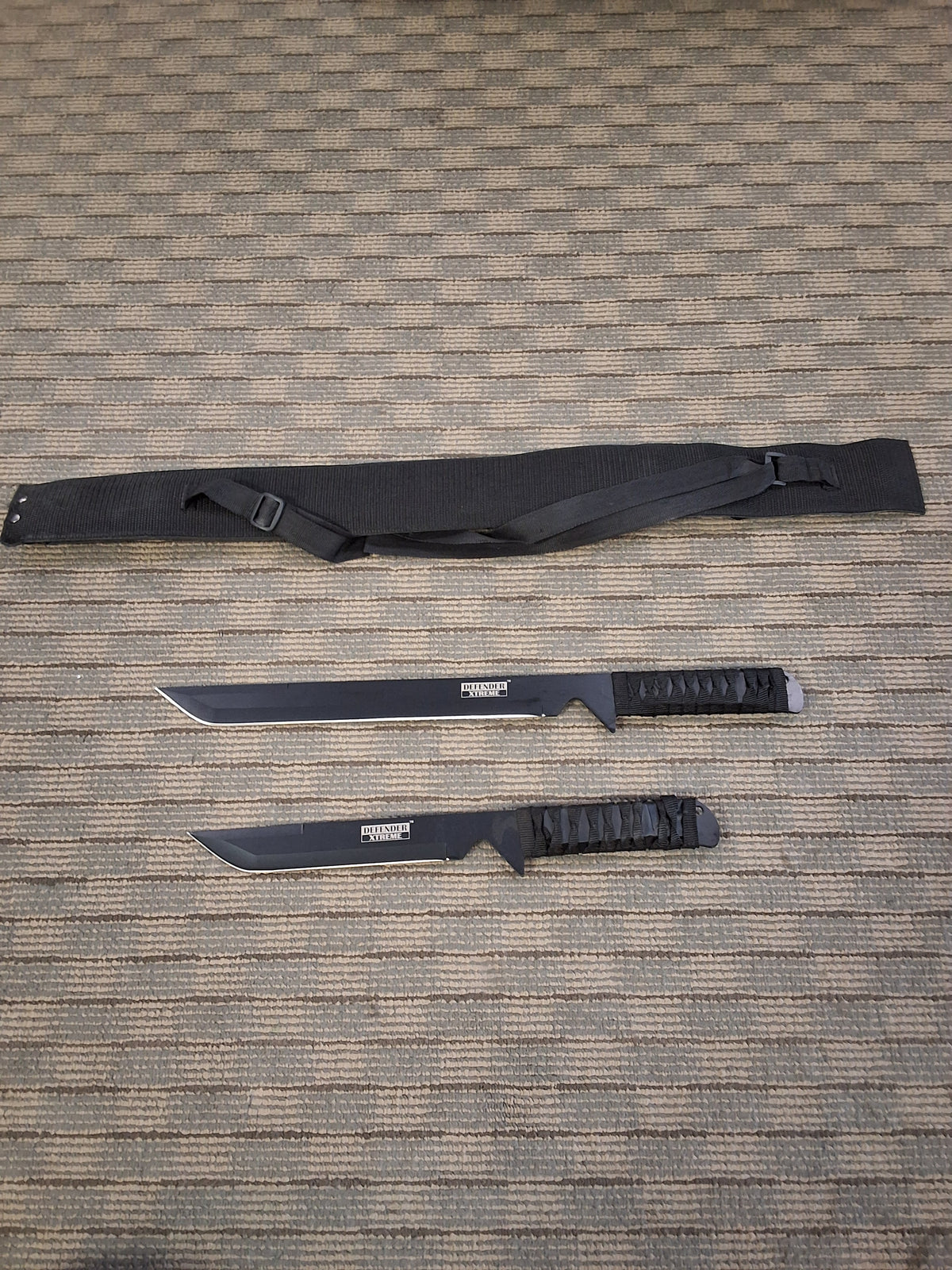 Two black short blades and sheathe