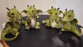 Green baby dragons individual with black claws