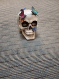 SKULL WITH BUTTERFLIES STATUE