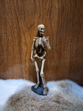 Skeleton Figure Holding Stone #1729