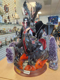 Itachi surrounded by flames and crows