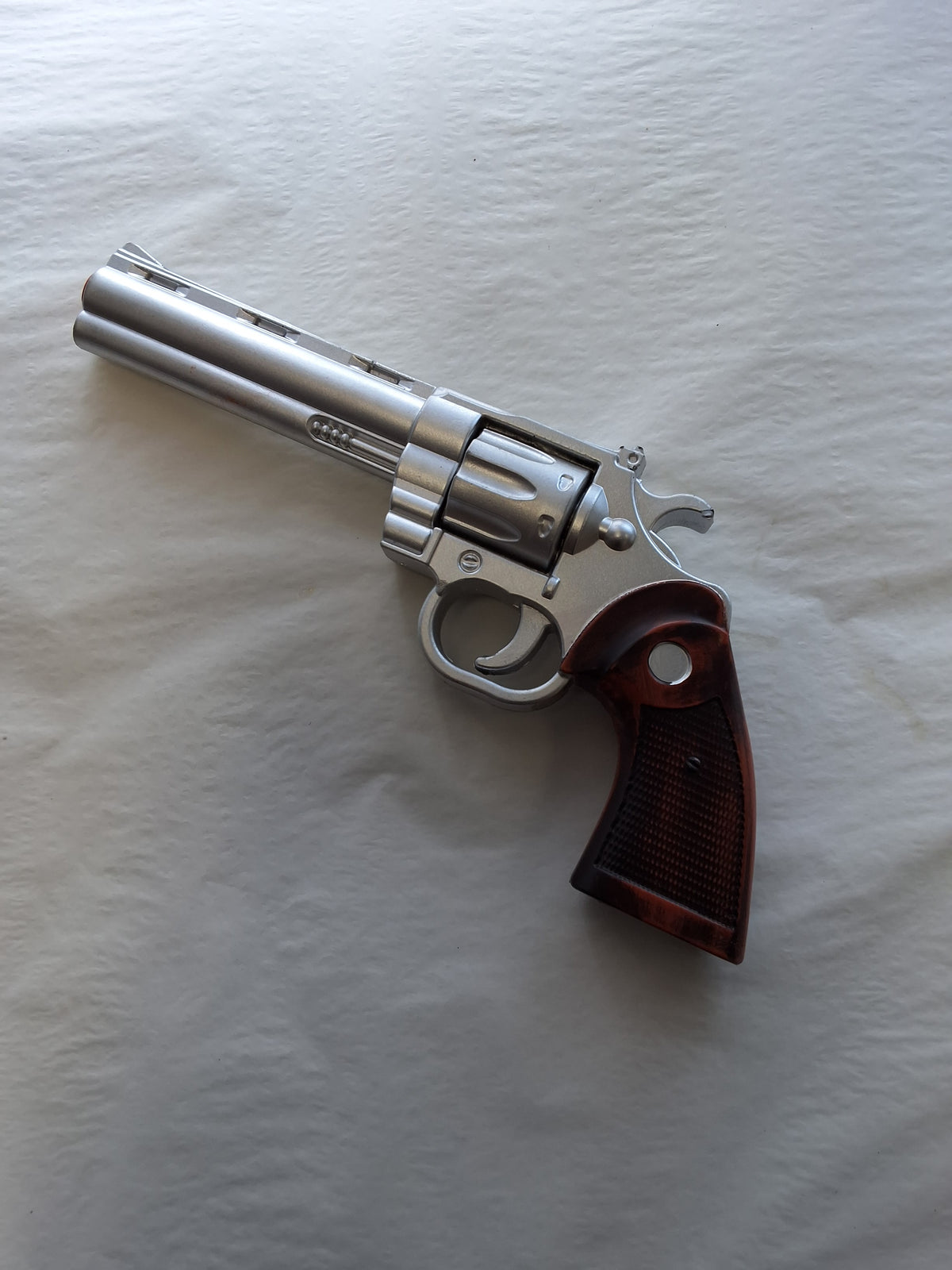 BROWN AND SILVER FOAM REVOLVER