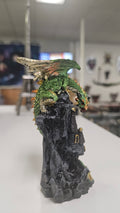 Dragon Sitting Over A Castle Turret