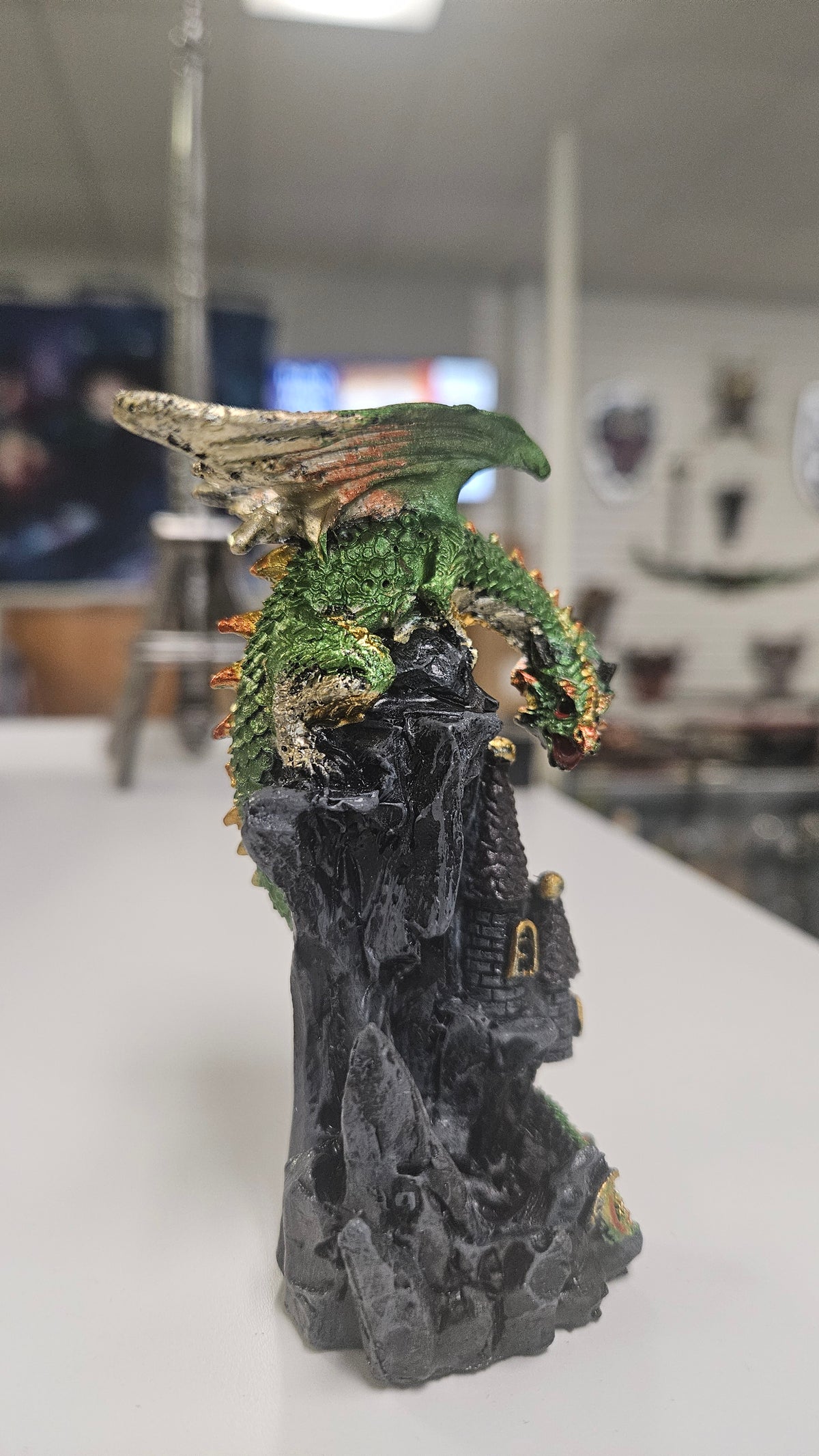 Dragon Sitting Over A Castle Turret