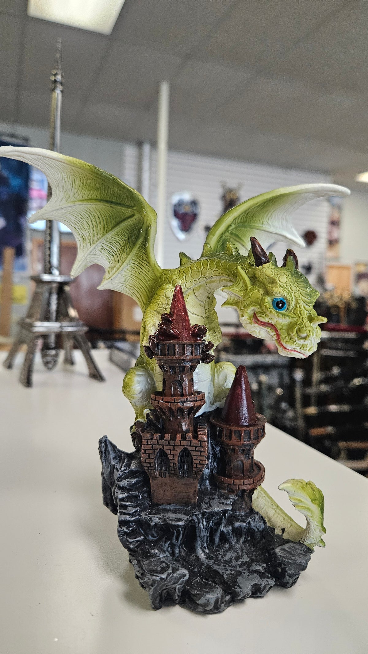 Small Green Dragon on castle