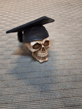 SKULL WITH GRADUATION CAP