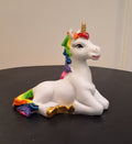 Rainbow unicorn sitting