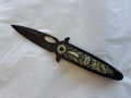 Gold and black folder with B on handle