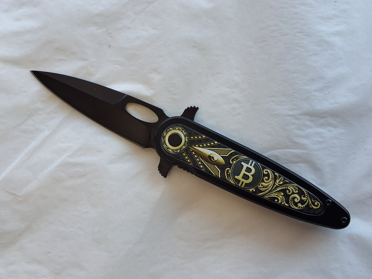 Gold and black folder with B on handle