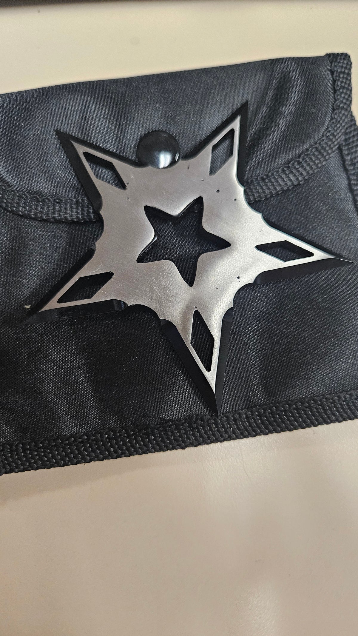 Black silver single throwing star