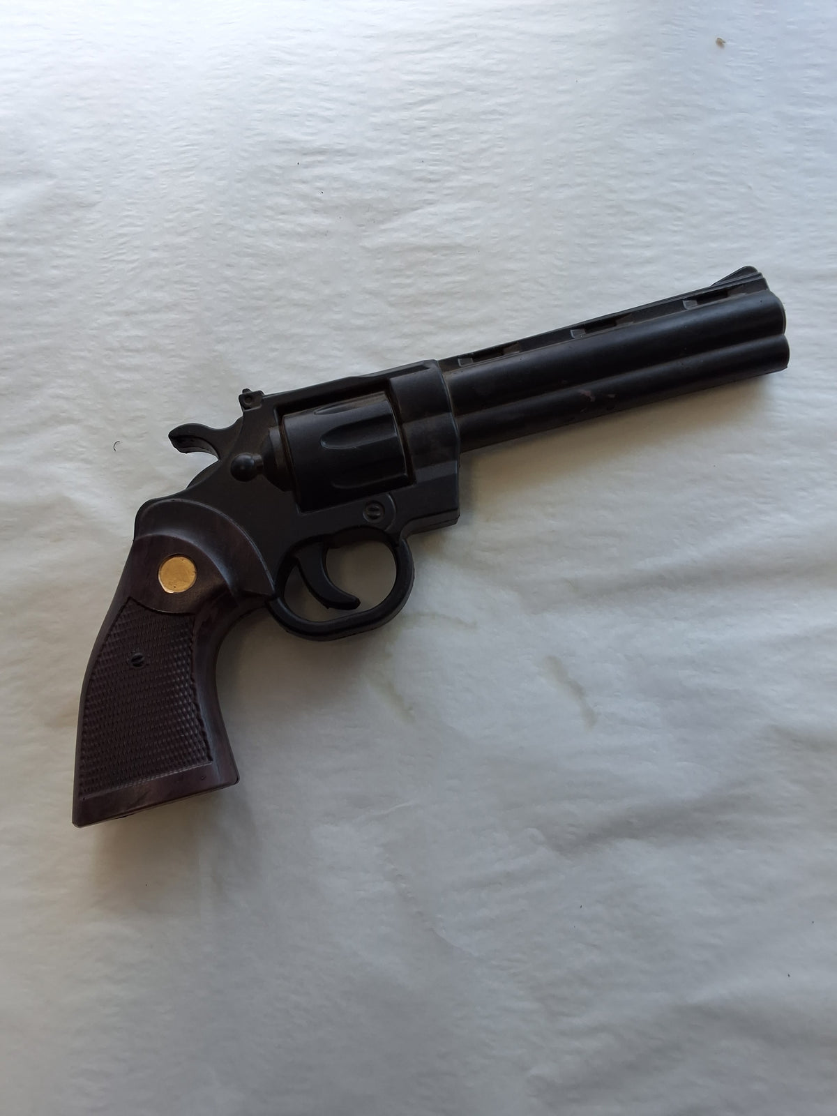 BLACK AND GOLD  FOAM REVOLVER
