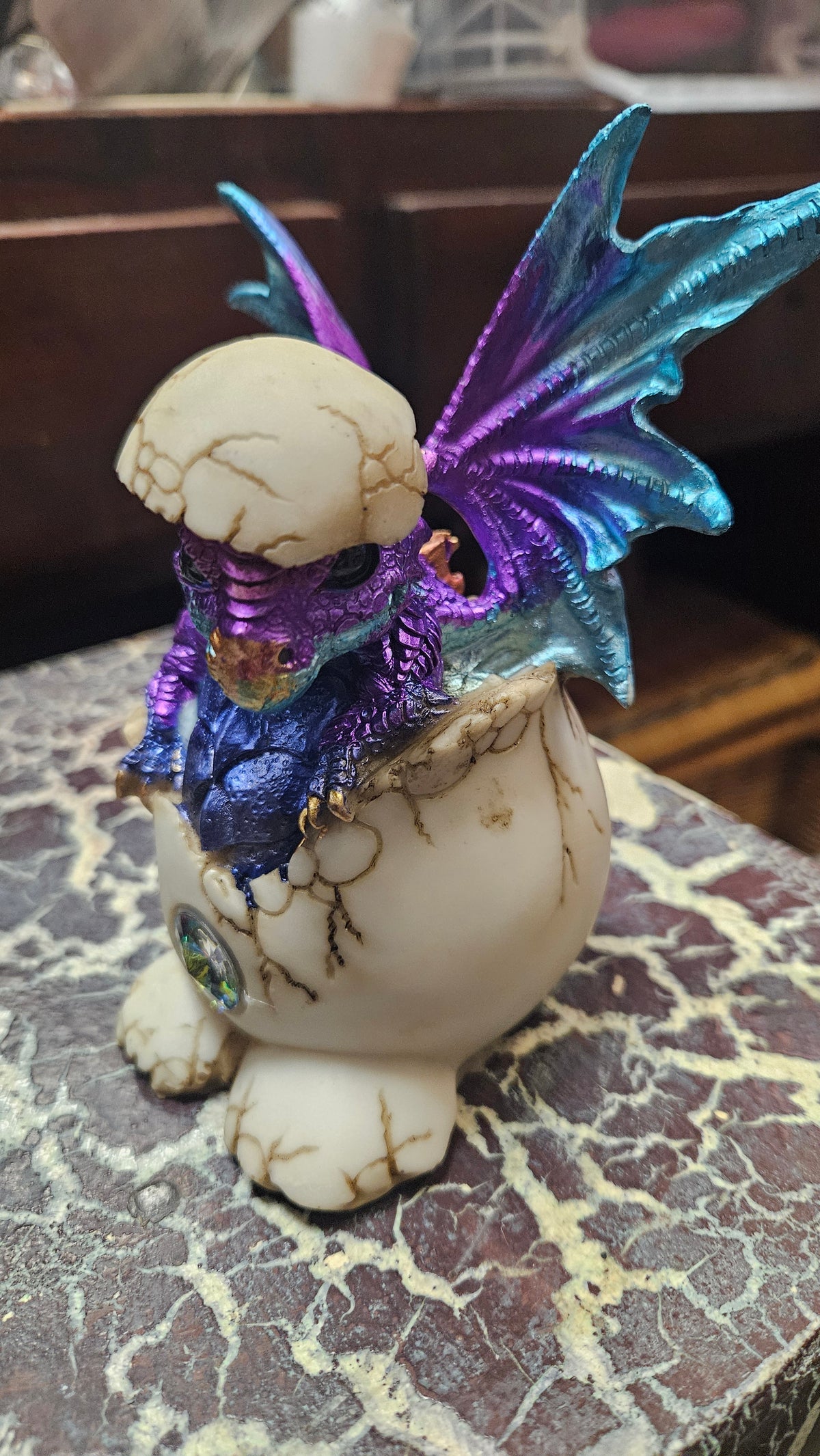 Purple baby dragon in egg