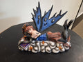 Very Blue Fairy Laying On The Clouds And Stars With A Book